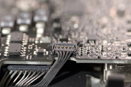 close up Ribbon cable connect to mainboard circuit