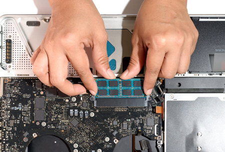 technician install upgrade memory for laptop computer