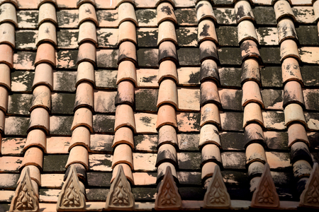 Old red brick roof tiles from country of thailandの写真素材