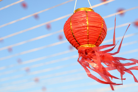 Red Chinese Paper Lanterns against  Blue Skyの写真素材