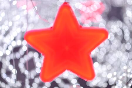 red star with white bokeh blure styleの写真素材