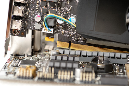 close-up put video card to slot on motherboard computerの写真素材