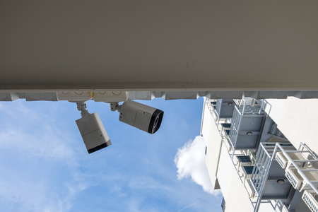 cctv camera system in building and blue skyの写真素材