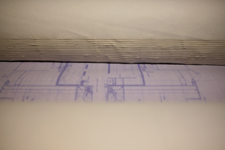 close up blueprint roll old on the table in officeの写真素材
