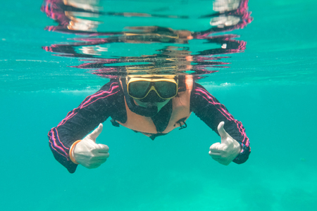 girl  snorkeling mask under water from thailandの写真素材