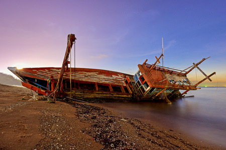 Ship capsized in pattaya city thailand at nightの写真素材
