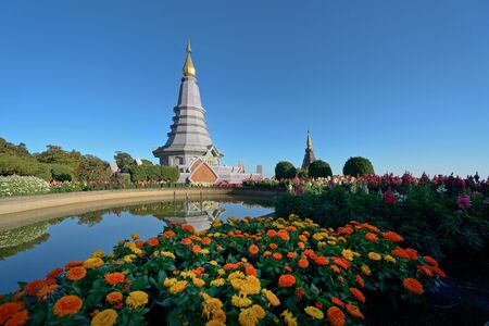 The pagoda on the top of Doi Inthanon reflects the water.の写真素材