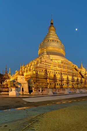 Golden pagoda at Shwezigon the temple of Myanmar in the eveningの写真素材