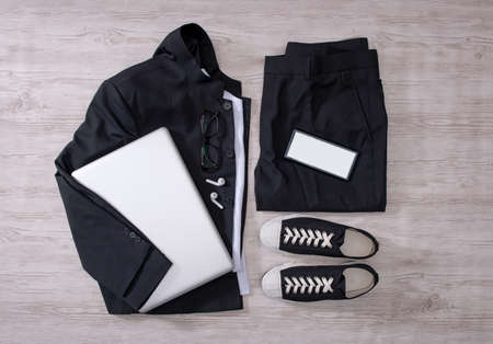 Clothes trousers and shoes on the floorの写真素材