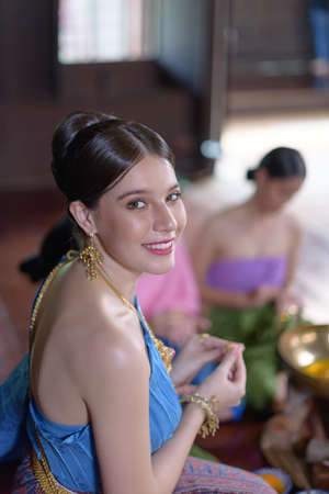 Thai people make Thai dessert in Thai period costumeの写真素材
