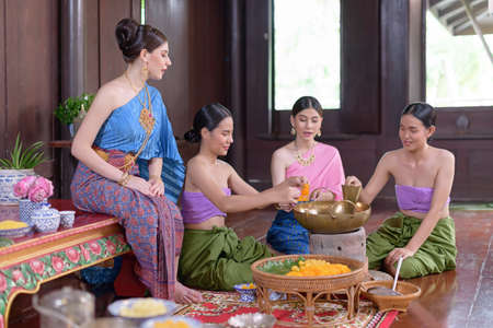 Thai people make Thai dessert in Thai period costumeの写真素材