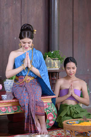 Thai people make Thai dessert in Thai period costumeの写真素材
