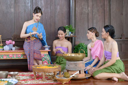 Thai people make Thai dessert in Thai period costumeの写真素材