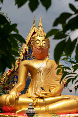 Buddha statues with masks In the year of the coronavirus outbreakの写真素材