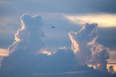 Clouds in the evening sky and planesの写真素材