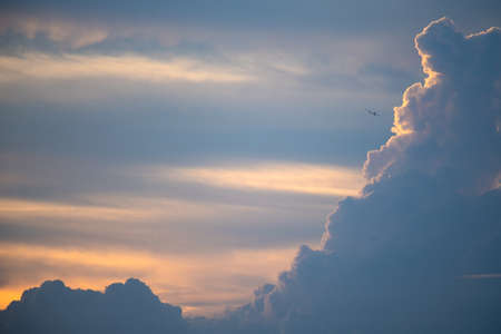 Clouds in the evening sky and planesの写真素材