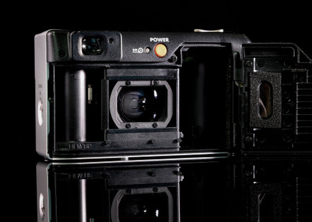 Retro film camera, close-up, back view, on black background.の写真素材