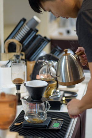 barista is preparing equipment for making coffee.