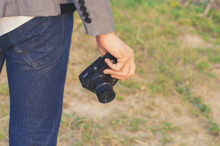 Photographer holding his camera.の写真素材
