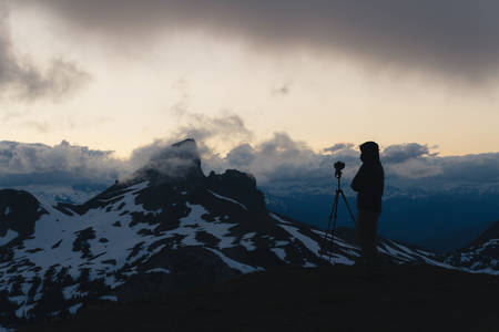 Cloudy moody sunset in snow mountains above Garibaldi Lake on Panorama Ridgeの写真素材