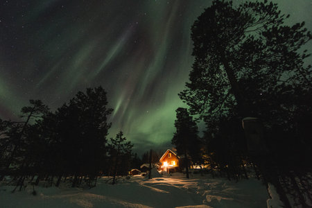 Frozen land in scandinavia and Aurora in the sky