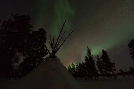 Frozen land in scandinavia and Aurora in the sky