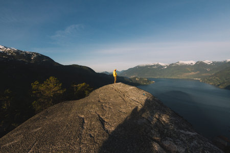 Mountains range while sunrise with sleeping bags on rock