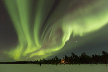 Frozen land in scandinavia and Aurora in the skyの写真素材