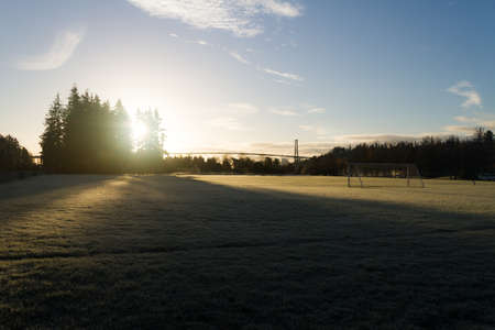 Bridge, golden color of sunrise and lonely morning atmosphereの写真素材