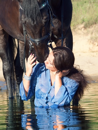 kiss of pretty girl to yours  horseの写真素材