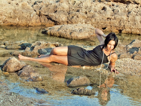 sexual woman near rocksの写真素材