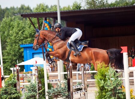 SAINT PETERSBURG-JULY 08: Rider Urmas Raag on Axel du beaumont in the CSI3*-W/CSIYH1* International Jumping Grand Prix FEI World Cup Competition on July 08, 2012 in Saint Petersburg, Russia.のeditorial素材