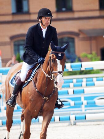 SAINT PETERSBURG-JULY 08: Rider Gunnar Klettenberg on Bingo in the CSI3*-W/CSIYH1* International Jumping Grand Prix FEI World Cup Competition 140-160cm on July 08, 2012 in Saint Petersburg, Russia.のeditorial素材