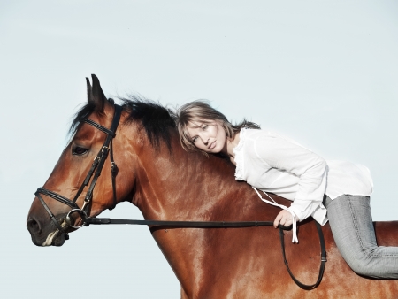  beautiful  girl  riding on horse  sunny eveningの写真素材