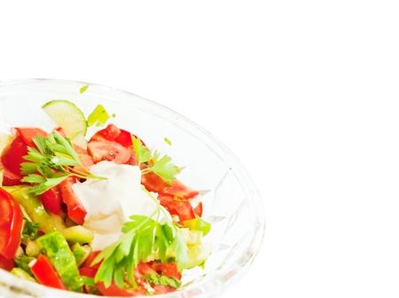 Fresh salad with tomatoes, papper and cucumbers and creamの写真素材