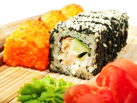  rolls with black roe and sesame and baking sushi on bamboo matの写真素材