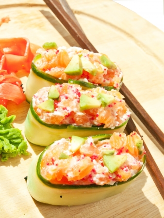 Fresh cucumber sushi with  salmon and avakadoの写真素材