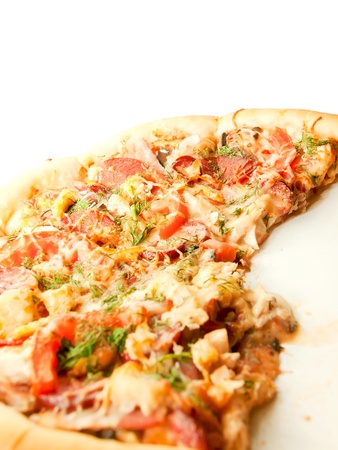 Pizza with tomato and sausage isolated on whiteの写真素材