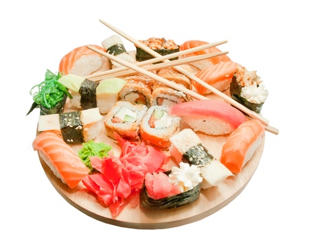 sushi set  and chopsticks on the desk isolated on whiteの写真素材