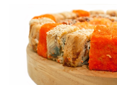  sushi rolls in range on the desk isolated on whiteの写真素材