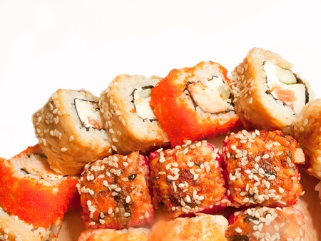  sushi rolls in range on the desk isolated on whiteの写真素材