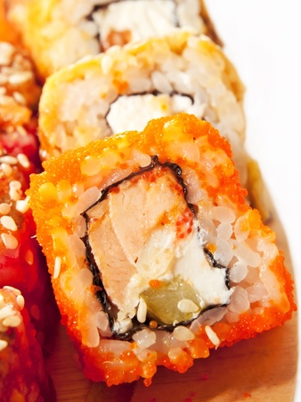  sushi rolls in range on the desk  closeup isolated on whiteの写真素材