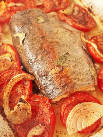 baked  trout with tomatoes and onion for Mediterranean recipeの写真素材