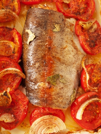 baked  trout with tomatoes and onion for Mediterranean recipeの写真素材