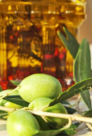 green olives and olive oil closeupの写真素材