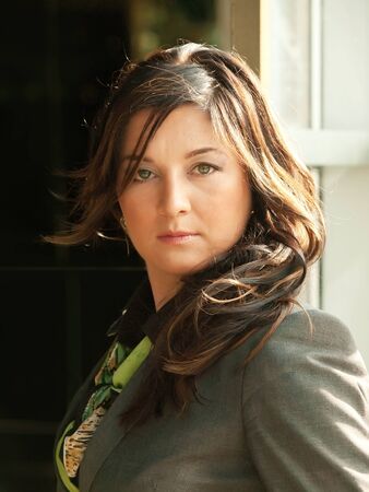 busineeslady in grey pantsuit portrait の写真素材