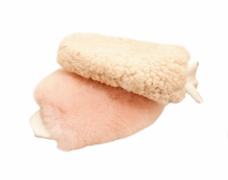 sheepskin mittens for finishing grooming horse isolated の写真素材