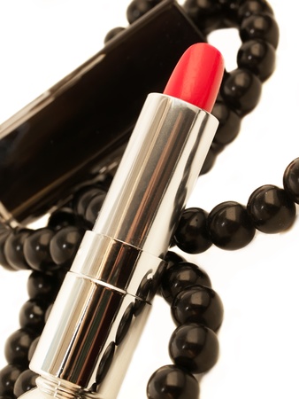 close up of a lipstick on white background with clipping path and beadの写真素材