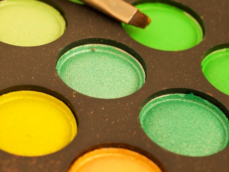 multicolored eye shadows with cosmetics brushの写真素材