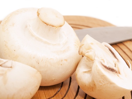 Champignon mushroomes  at the  cutting board. macroの写真素材